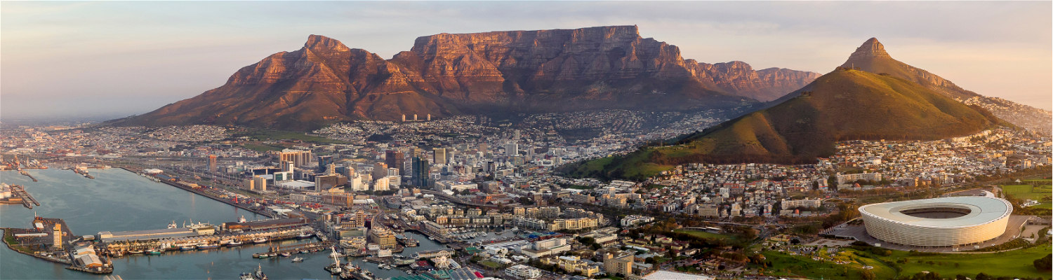 Arial photograph of Mother City in Cape Town, with Table Mountain and city bowl in the picture. 
