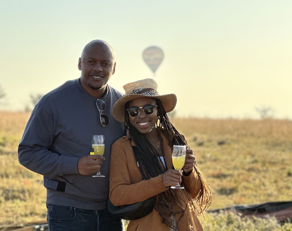 A couple toasting their hot air balloon flight.