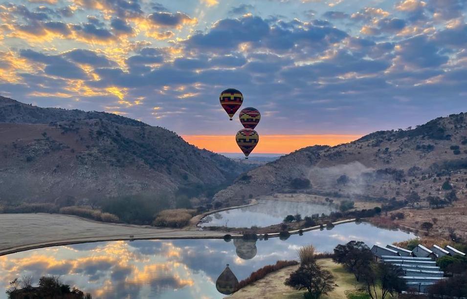 Hot air balloons launching from Kloofzicht Lodge in the Cradle of Humankind.