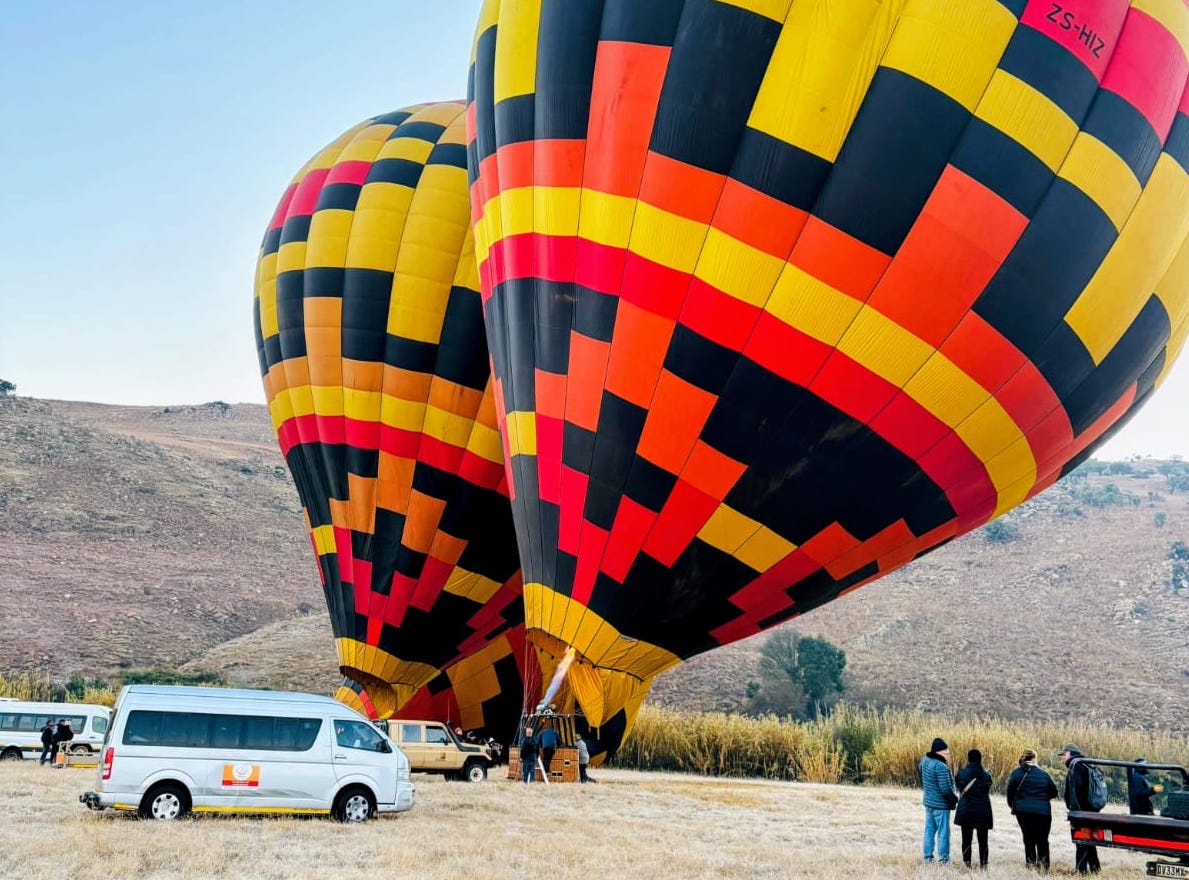Hot air balloons inflating.