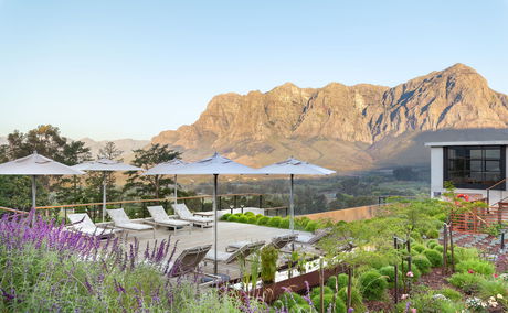 De Zeven Guest Lodge, mountain views and pool deck. Located in Banhoek Valley, near Stellenbosch and Franschhoek, Cape Winelands South Africa.