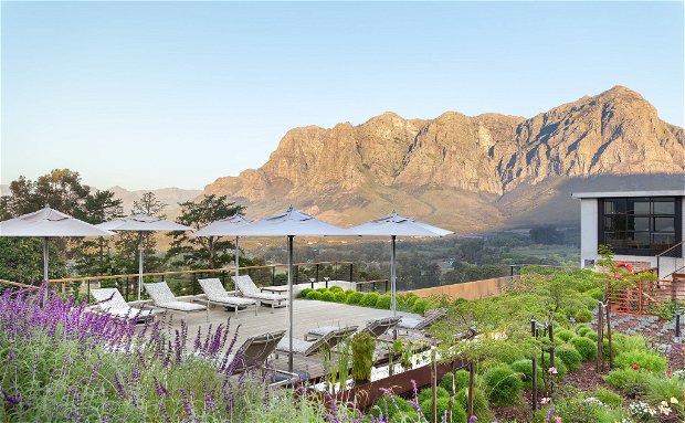 De Zeven Guest Lodge, mountain views and pool deck. Located in Banhoek Valley, near Stellenbosch and Franschhoek, Cape Winelands South Africa.