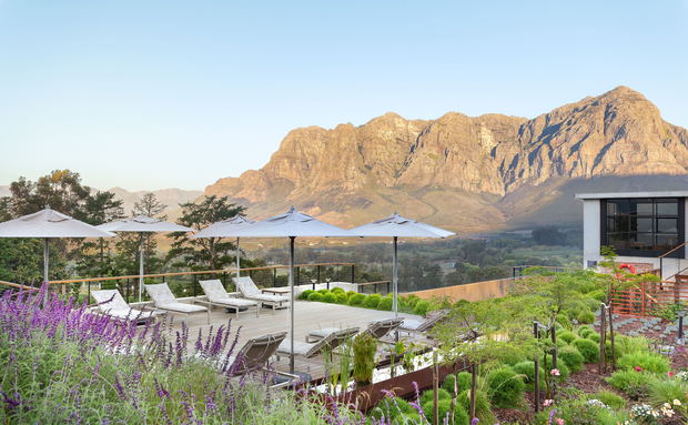 De Zeven Guest Lodge, mountain views and pool deck. Located in Banhoek Valley, near Stellenbosch and Franschhoek, Cape Winelands South Africa. De Zeven Guest Lodge, mountain views and pool deck. Located in Banhoek Valley, near Stellenbosch and Franschhoek, Cape Winelands South Africa.