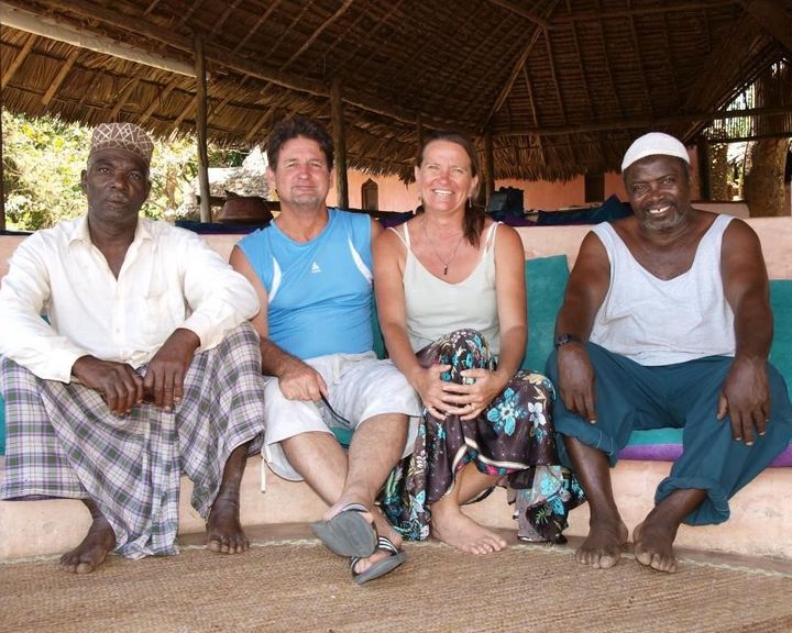 Jean and Anne de Villiers with two members of the Chole village community, at Chole Mjini Treehouse Lodge on Chole Island, Mafia Island, Tanzania