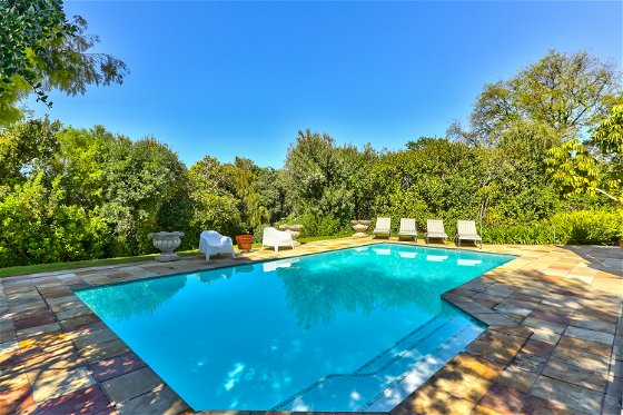 Pool with sun loungers and towels provided