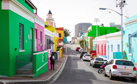 A vibrant street view of Cape Town’s iconic Bo-Kaap neighbourhood, known for its colourful houses, rich Cape Malay heritage, and cultural significance. A popular tourist destination located near Devonport House, ideal for scenic walks, photography, and historical exploration.