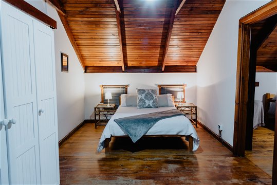 Large bedroom 1 with double bed, large closets, a chest and forest views at The Wooden Forest House