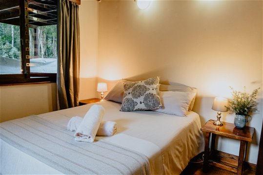 Downstairs bedroom 2 with double bed and scenic views at The Wooden Forest House 