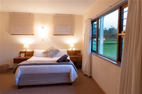 Double bed in the spacious main bedroom at Natures Way Farmhouse