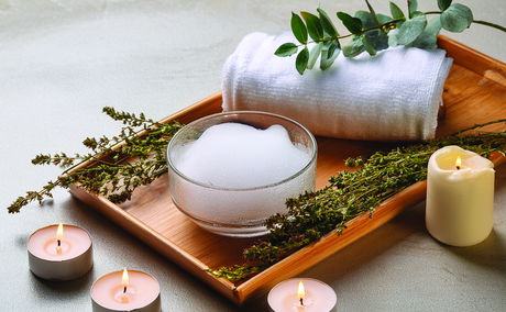 foam scrub and candle light