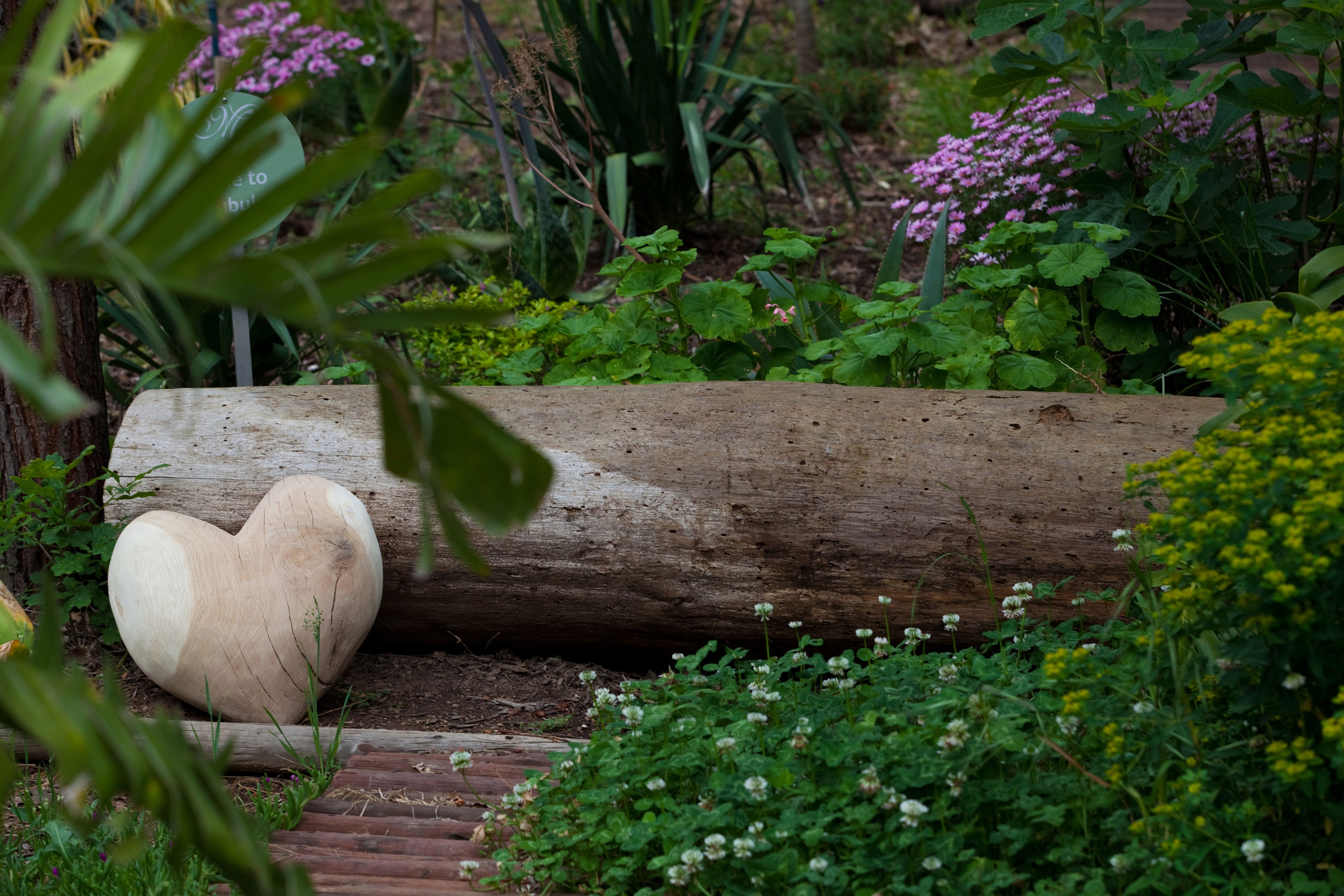 wooden heart in the secret garden