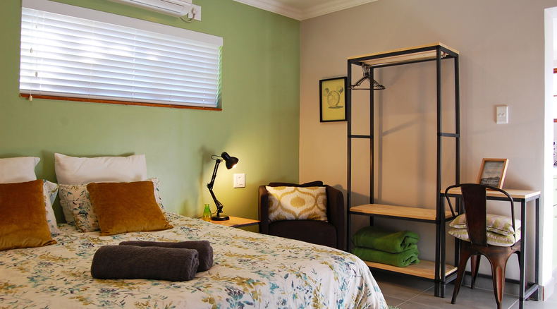 Small but comfortable room on the first-floor that uses modern finishings to utilise space optimally. Funky art on the walls compliments the tranquil but fresh feel of the room. Small balcony provides a mountain view experience. 