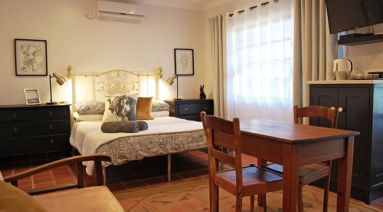 Comfortable but spacious room with up-scaled antique furniture, rustic qualities and terracotta flooring creating a farmhouse feel but with all the modern amenities one needs to have a great evening. Comfortable but spacious room with up-scaled antique furniture, rustic qualities and terracotta flooring creating a farmhouse feel but with all the modern amenities one needs to have a great evening.