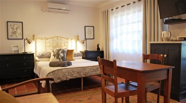 Comfortable but spacious room with up-scaled antique furniture, rustic qualities and terracotta flooring creating a farmhouse feel but with all the modern amenities one needs to have a great evening. 