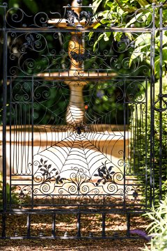 A magical gateway to the fountain in the garden