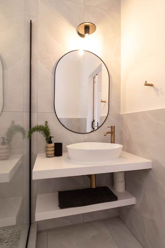 Main en-suite bathroom is fitted with a large shower, toilet and vanity.