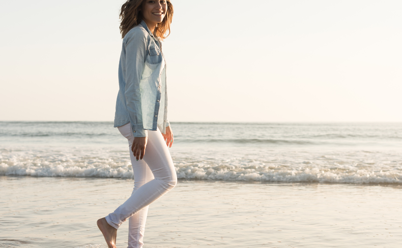 Solo female traveller on the beach