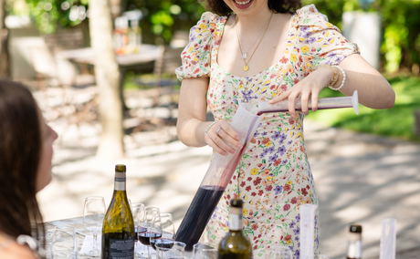 Young lady blending wine at grande provence Young lady blending wine at grande provence