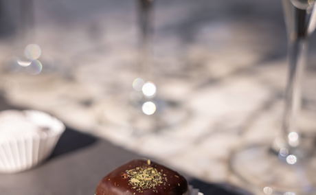 A chocolate cup cake on a dining table from Grande Provence, for a birthday celebration A chocolate cup cake on a dining table from Grande Provence, for a birthday celebration
