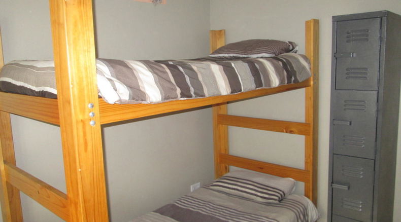 Bedroom with 4 wooden bunk beds 