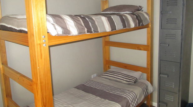 Bedroom with 4 wooden bunk beds 