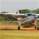 Cessna 208 Caravan taking off and flying across Uganda.
