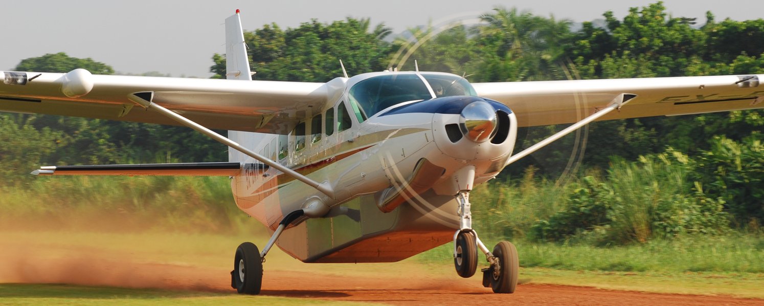 Cessna 208 Caravan taking off and flying across Uganda.