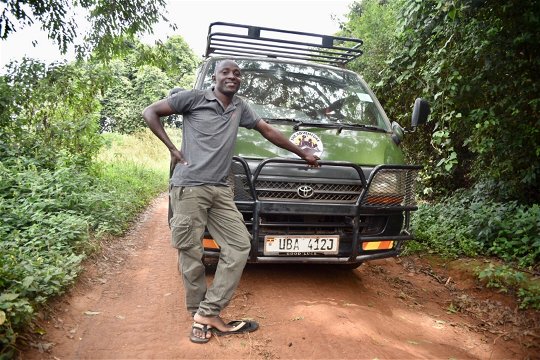 Tom, one of our driver guides with a Toyota Super Custom on safari in Uganda.