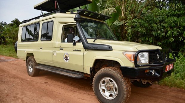 The Adventure Committee on safari in a Toyota Land Cruiser, Uganda