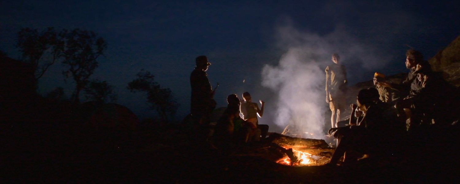 Camping around the fire at the kraal, Karamoja, Uganda