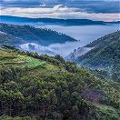 The morning mists rising from the hills around Lake Bunyonyi, Uganda