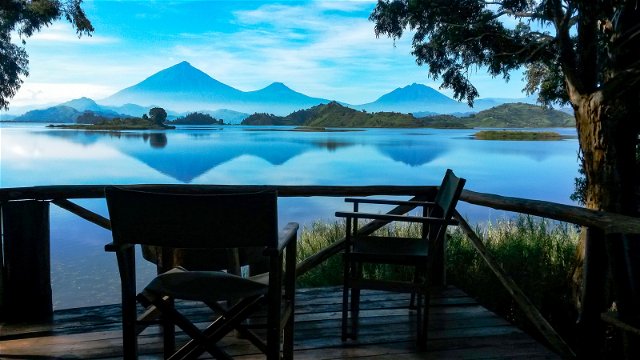 Terrace views over Lake Mutanda to the Virunga volcanoes, Mutanda Lake Resort, Uganda