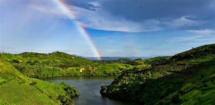 A rainbow in Ndali-Kasenda crater lake fields, close by to Kibale National Park, Uganda