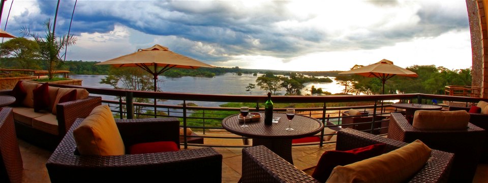 The terrace and lounge area with a view over the river Nile at Chobe Safari Lodge, Uganda