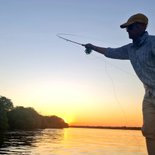 Angler fly fishing at Ngombe Zambezi River Lodge