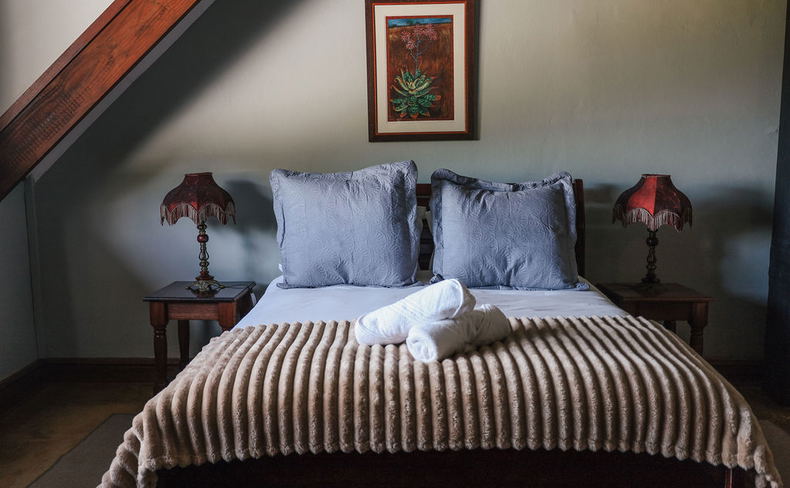 upstairs en-suite family suite with sitting area and magnificent views overlooking the Drakensberg Mountains upstairs en-suite family suite with sitting area and magnificent views overlooking the Drakensberg Mountains