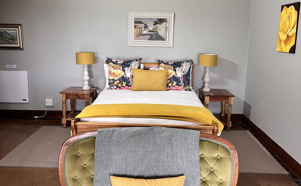 room 5 superior downstairs queen with seating area, fireplace, en-suite bathroom and double shower and closed-in porch overlooking Drakensberg Mountains room 5 superior downstairs queen with seating area, fireplace, en-suite bathroom and double shower and closed-in porch overlooking Drakensberg Mountains