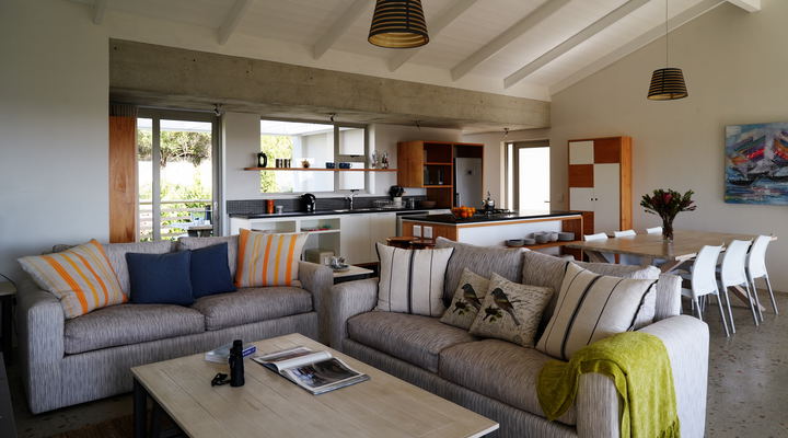 The spacious living room , kitchen, dining floor leads onto two verandas and the swimming pool.