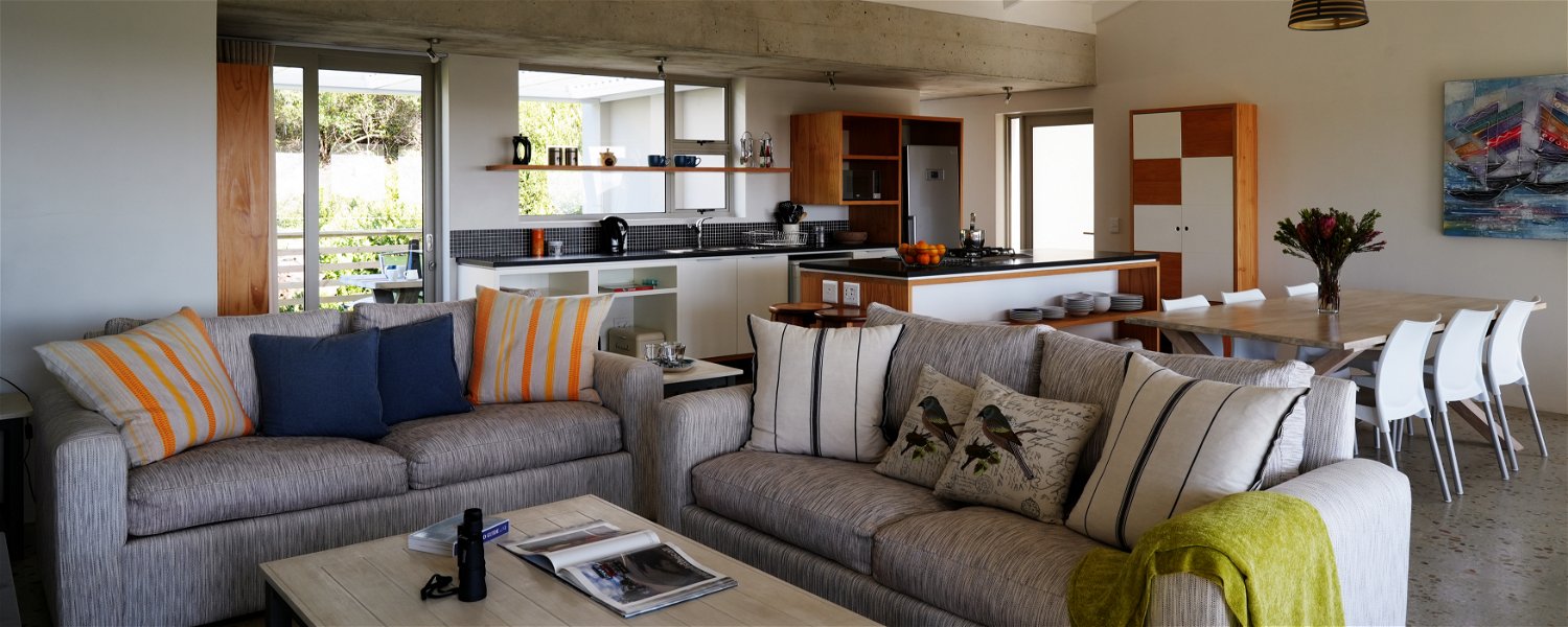The spacious living room , kitchen, dining floor leads onto two verandas and the swimming pool.