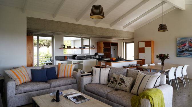 The spacious living room , kitchen, dining floor leads onto two verandas and the swimming pool.