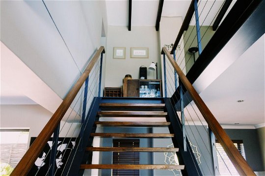 Stairway to Constantiaberg Suite - mezzanine level