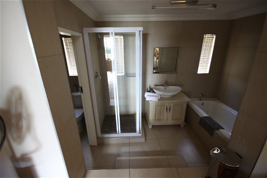 Apartment 1: Main bedroom with en-suite bathroom with bath & shower