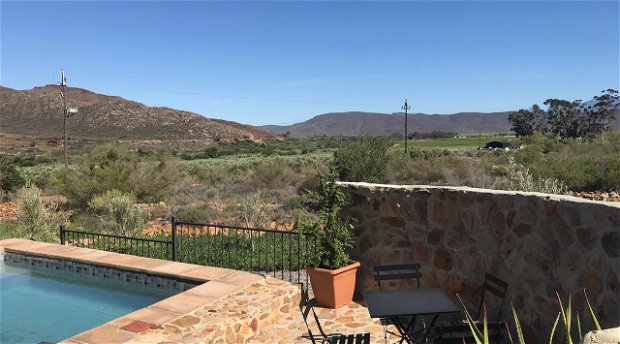 Relax in the pool over looking the valley