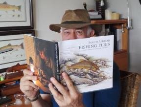 Author Peter Brigg with a copy of the book South African Fishing Flies