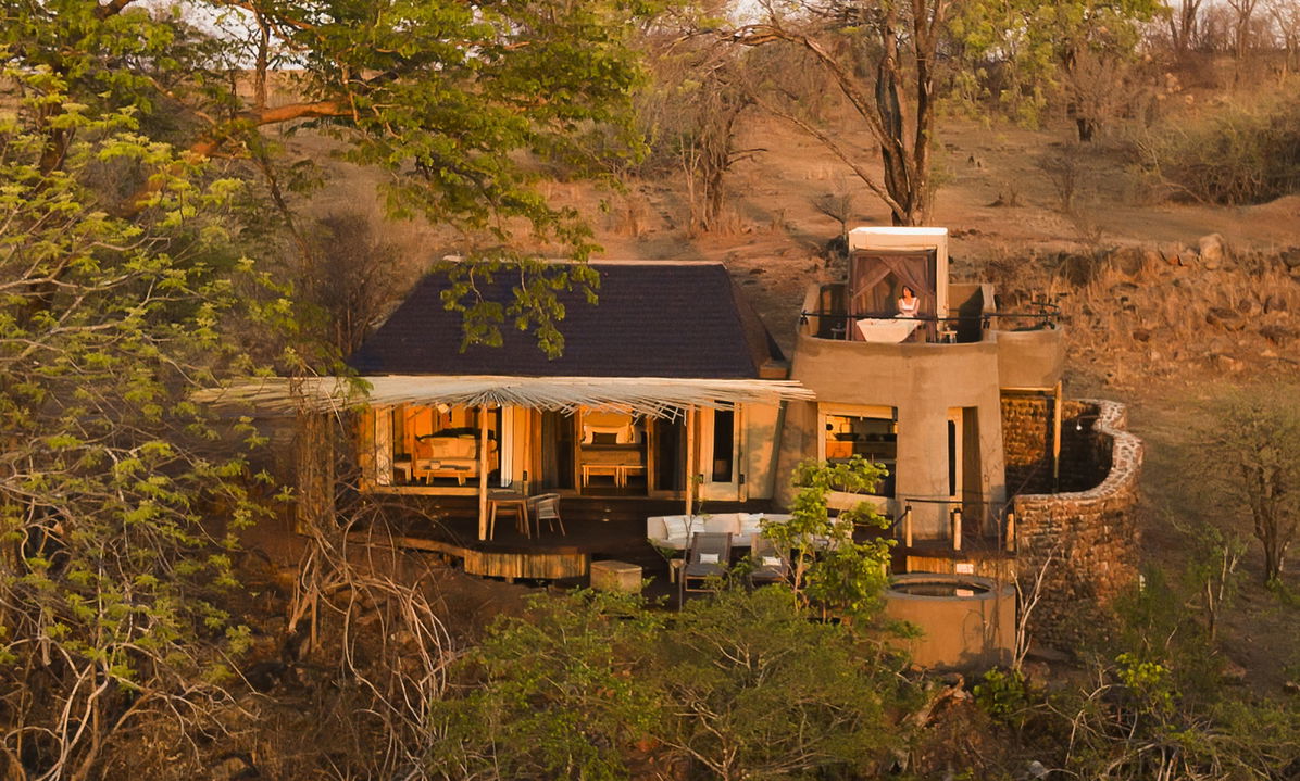 semi aerial view of suite at sunset by Puku Ridge Camp Zambia