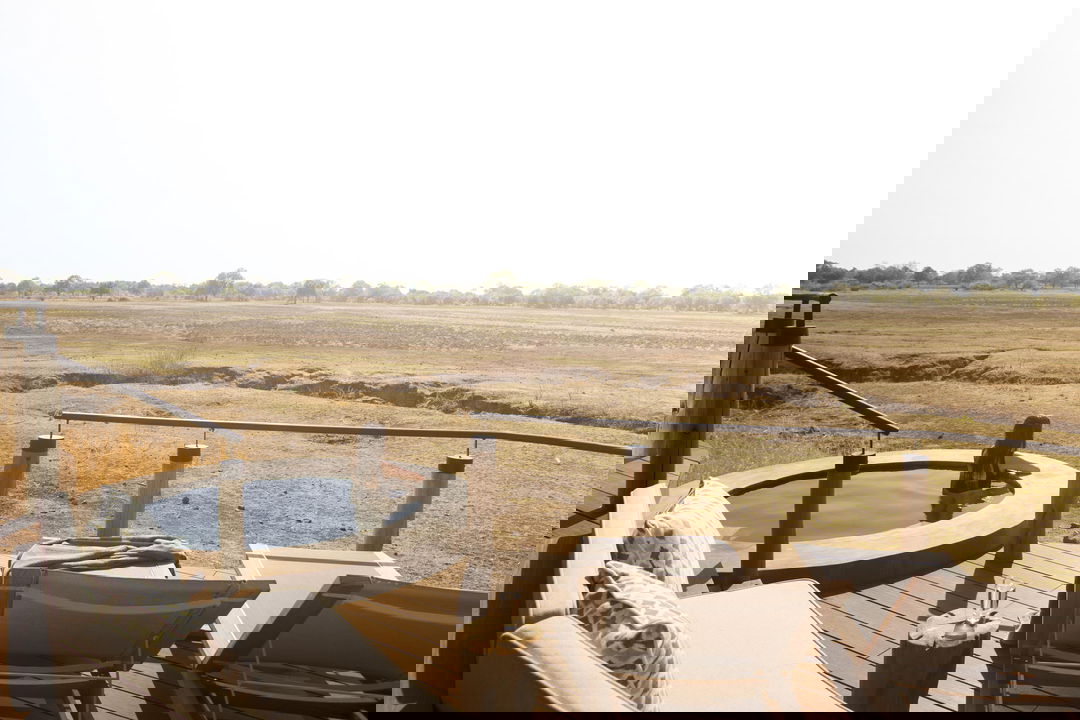 splash pool on deck with views of floodplains beyond at Puku Ridge Camp Zambia
