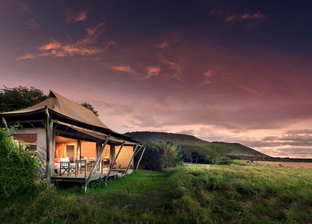 exterior view at sunset of superior view tent at andBeyond Kichwa Tembo Camp Kenya Masai Mara