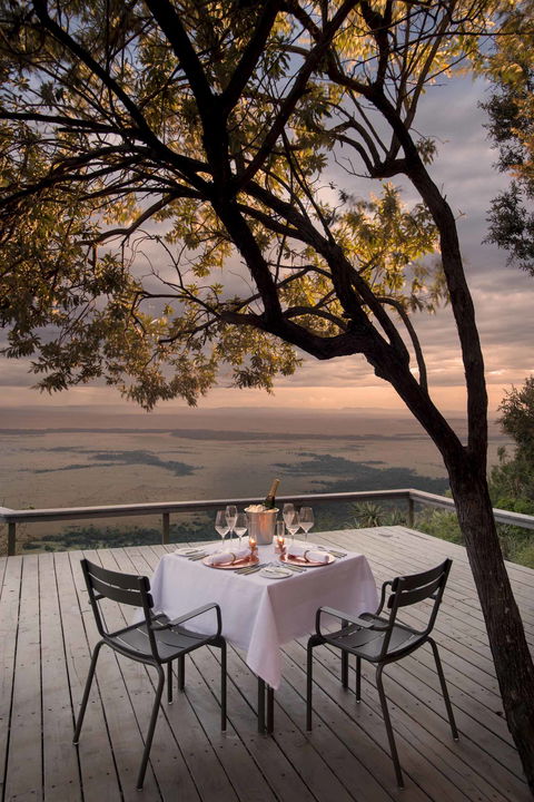 private dinner setting on deck of Angama Mara Kenya Masai Mara