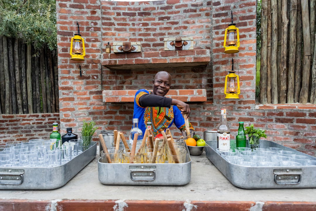 barman making cocktails at the bar of Angama Mara Kenya Masai Mara