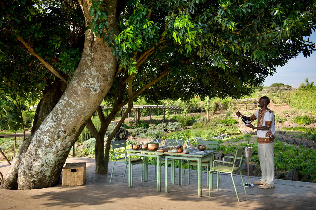tables set on deck for shamba lunch at Angama Mara Kenya Masai Mara